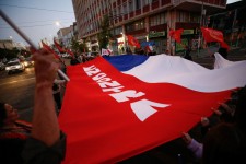 Left: People against the draft of a new Chilean constitution react on the day of the referendum in Valparaiso, Chile, Dec. 17, 2023. Photo by Rodrigo Garrido/REUTERS