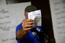 A volunteer holding a ballot in Caracas, Venezuela, October 2023 Leonardo Fernandez Viloria / Reuters