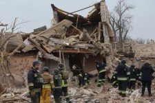 Rescue workers and police officers work on Friday at the site of a missile strike in Zaporizhzhia, Ukraine. PHOTO: KATERYNA KLOCHKO/SHUTTERSTOCK