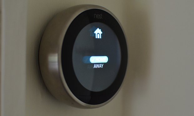  The thermostat uses its built-in sensors and the location of users’ smartphones to set itself as away, disabling the schedule. Photograph: Samuel Gibbs for the Guardian