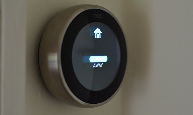 The thermostat uses its built-in sensors and the location of users’ smartphones to set itself as away, disabling the schedule. Photograph: Samuel Gibbs for the Guardian