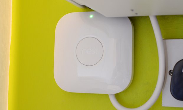 The Heat Link is wired into the boiler to relay controls f-rom the thermostat. The Nest button in the centre manually turns the heating on or off in case of problems with the thermostat. Photograph: Samuel Gibbs for the Guardian