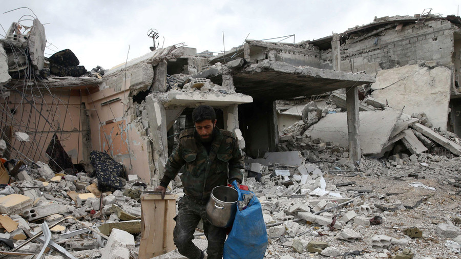 FILE PHOTO: A man walks on rubble of damaged buildings in the town of Douma, Eastern Ghouta © Bassam Khabieh / Reuters