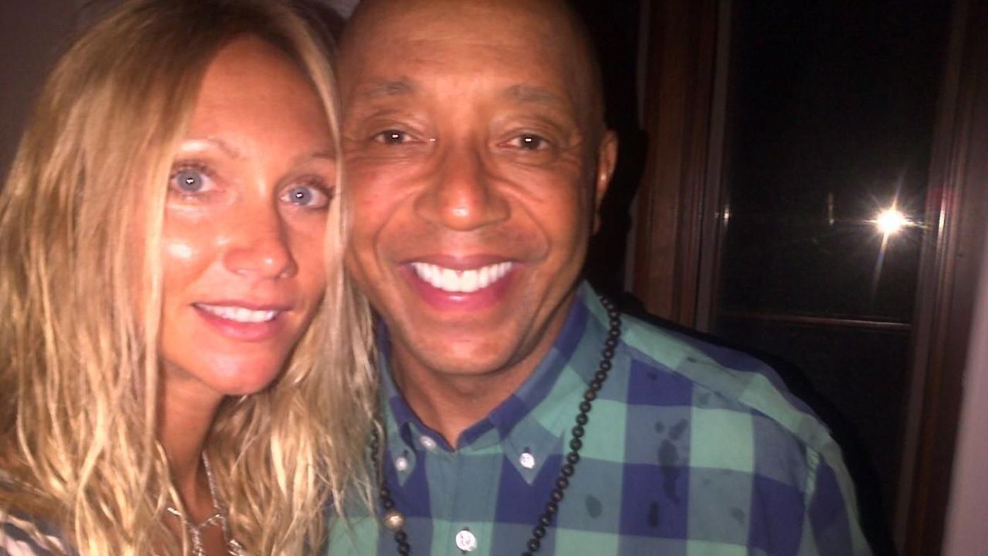 Jennifer Jarosik, pictured with Def Jam founder Russell Simmons, alleged in a federal lawsuit that the music mogul raped her in 2016. The lawsuit was dismissed Wednesday by agreement from both parties.