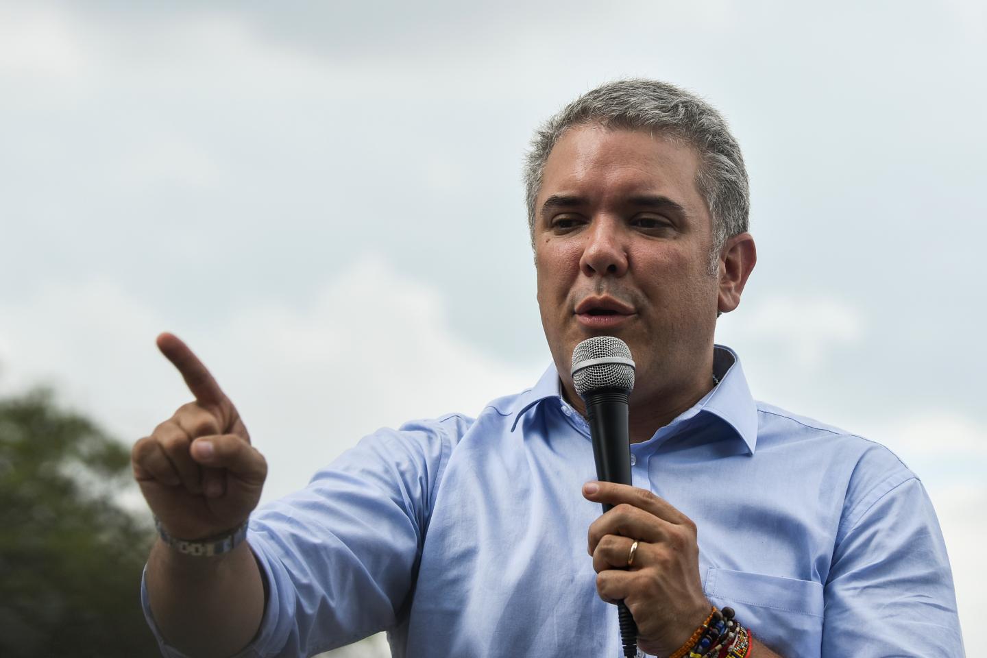 van Duque, the Democratic Center's candidate in Colombia's presidential race, speaks to supporters during a campaign rally in Cali on June 8. LUIS ROBAYO/AFP/GETTY IMAGES