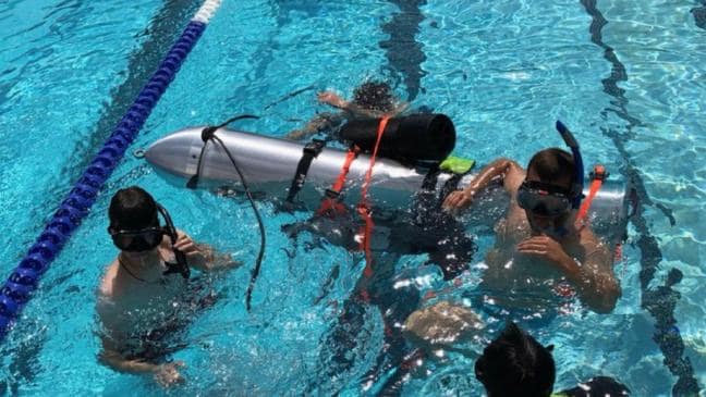 Divers test the device in a pool in Los Angeles. Picture: Elon Musk/ SuppliedSource:Supplied