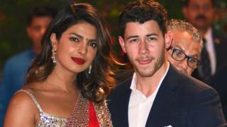 Priyanka Chopra and Nick Jonas arriving at a party together in JuneImage copyrightAFP/ GETTY IMAGES/ She is a Bollywood megastar who has crossed into American TV and films, while he is a singer, songwriter and actor