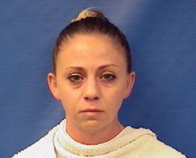 FILE - This file photo provided by the Kaufman County Sheriff&#39;s Office shows Amber Renee Guyger. Guyger, a Dallas police officer accused of fatally shooting her neighbor inside his own apartment has been dismissed, the police department annou