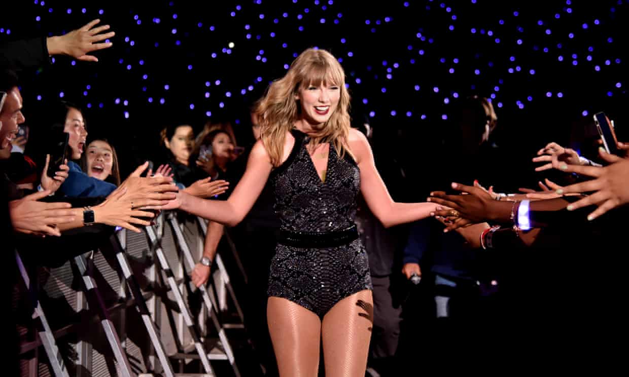 Taylor Swift high-fives fans during a concert at Levi’s Stadium in California in May. She wrote: ‘I believe that any form of discrimination based on sexual orientation or gender is WRONG.’ Photograph: Kevin Mazur/TAS18/Getty