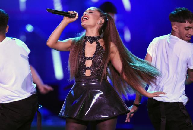 FILE - In this June 2, 2018 file photo, Ariana Grande performs at Wango Tango in Los Angeles. Billboard named the 25-year-old award-winning singer its 2018 Woman of the Year. Grande will receive the award at Billboard’s 13th annual Women in Music event on