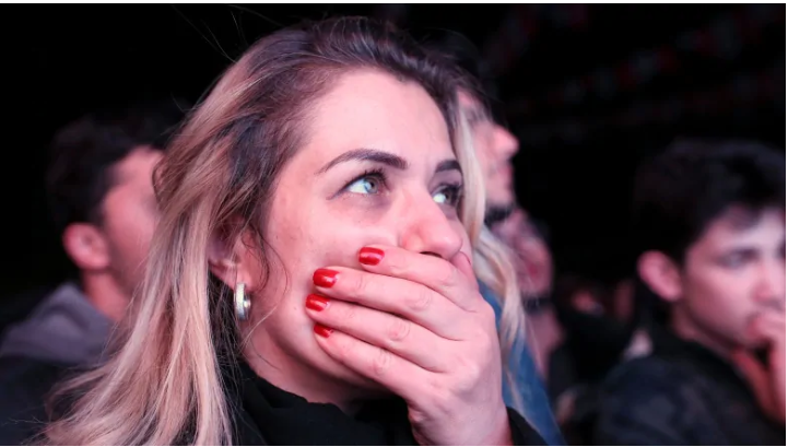 Supporters of the opposition Republican People's Party, CHP, react as the preliminary results of the local elections are announced in Ankara, Turkey, on Sunday. The opposition won control of Ankara, the capital, for the first time in more than a deca