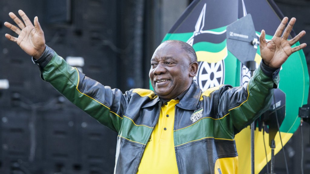 Wikus de Wet, AFP | President Elect of South Africa and President of the African National Congress (ANC) Cyril Ramaphosa greets the crowd after delivering a speech outside ANC's headquarters in Johannesburg on May 12, 2019.