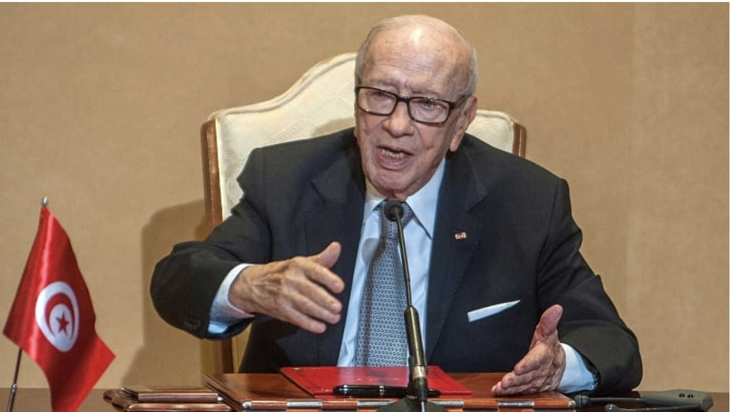 Tunisian President Beji Caid Essebsi, shown during a 2018 news conference in Tunis, has died at age 92. He was in a military hospital for medical treatment on Wednesday. (Hassene Dridi/Associated Press)