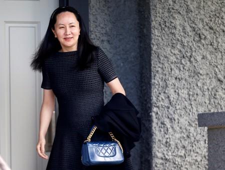 FILE PHOTO: Huawei&#39;s Financial Chief Meng Wanzhou leaves her family home in Vancouver, British Columbia