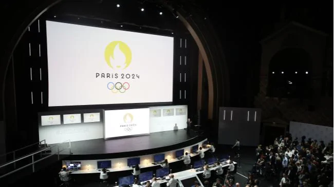 The 2024 Olympics logo is displayed on a screen during a ceremony in Paris. (AP Photo/Thibault Camus)Source:AP