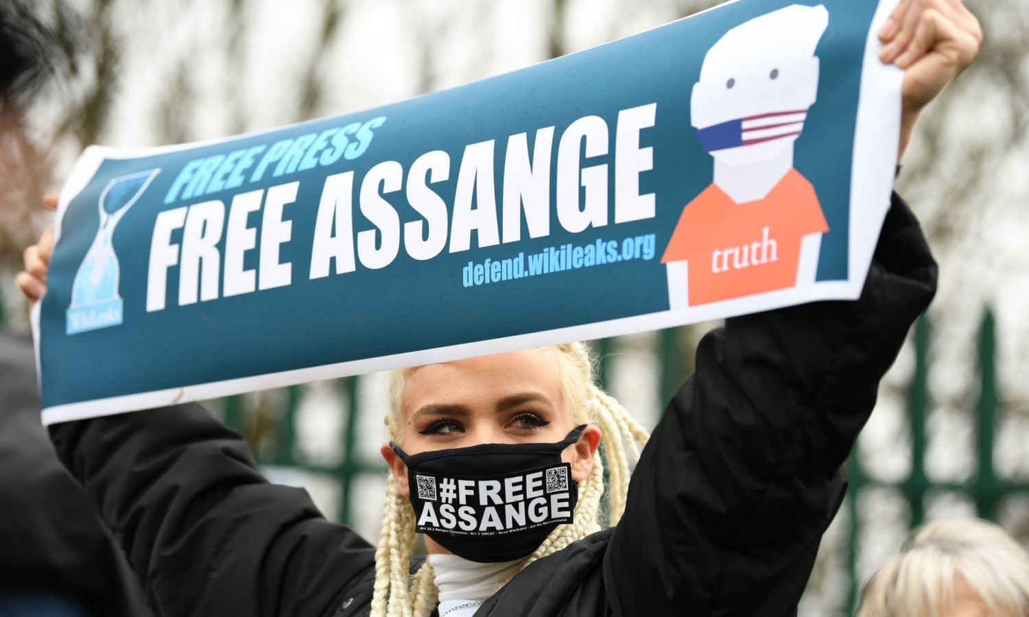 A supporter of Julian Assange protests outside Woolwich crown court in south-east London on Monday. Photograph: Daniel Leal-Olivas/AFP via Getty Images