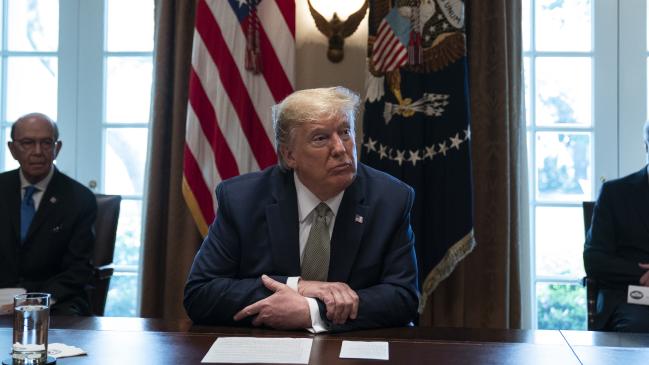 President Donald Trump listens has infuriated China by referring to coronavirus as a Chinese virus. Picture: AP Photo/Evan Vucci.Source:AP