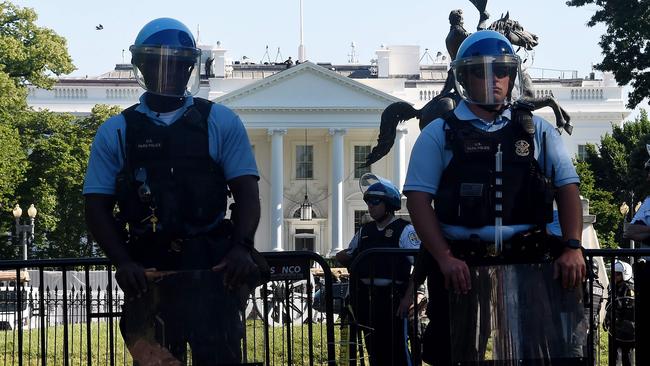 Police hold a perimetre near the White House as demonstrators gather to protest the killing of George Floyd. Picture: Olivier Douliery/AFPSource:AFP