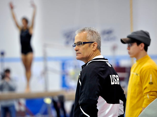 Coach John Geddert watches as World Champion gymnast Jordyn Wieber of DeWitt works on tumbling for a floor routine during a practice session at Gedderts' Twistars USA in Dimondale Monday 12/19/2011 . (Lansing State Journal staff pho