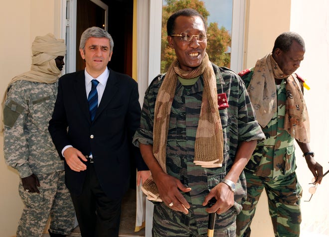 In this Feb. 6, 2008 file photo, Chad's President Idriss Deby Itno, center-right, meets with French Defense Minister Herve Morin, center-left, in N'Djamena, Chad. Deby, who ruled the central African nation for more than three decades, was killed