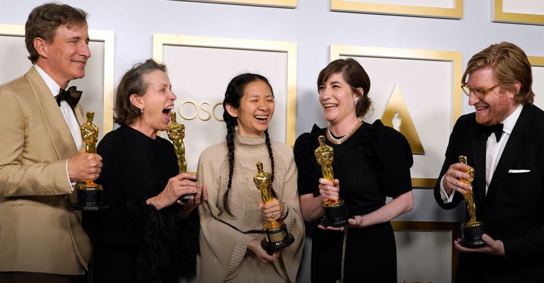 From left, producer Peter Spears, actress Frances McDormand, director Chloé Zhao, producer Mollye Asher and producer Dan Janvey pose with their Oscars in the press room after their film "Nomadland" won best picture on Sunday, April 25.Chris Pizz