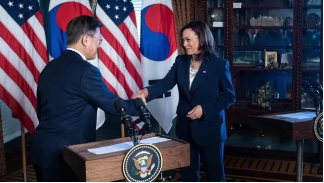 Kamala Harris appeared to wipe her hand on her trousers immediately after shaking hands with the South Korean President. Picture: Brendan Smialowski/AFPSource:AFP
