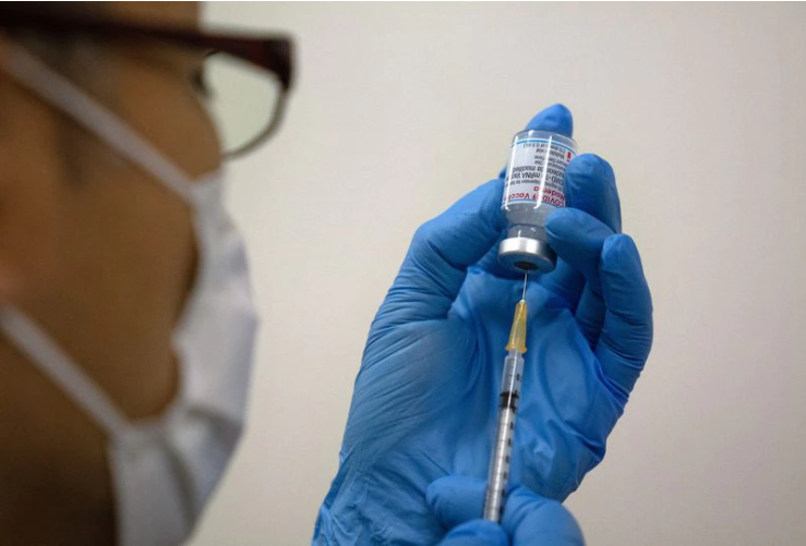 Medical staff prepare Moderna coronavirus vaccines. (CARL COURT/POOL/AFP via Getty Images)