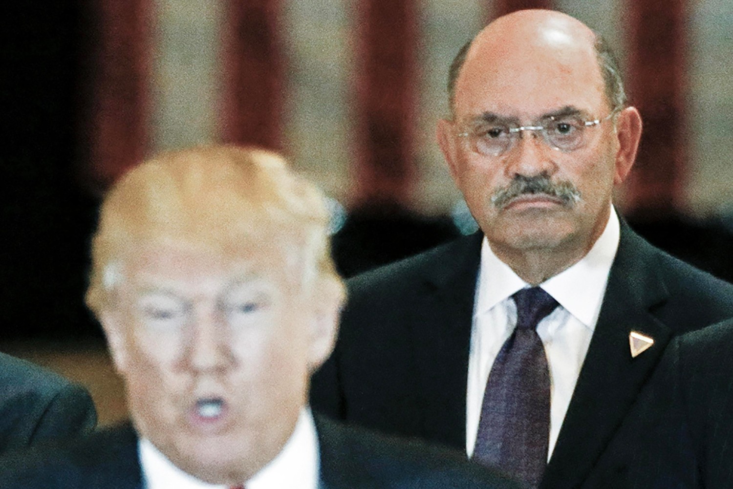 Trump Organization chief financial officer Allen Weisselberg looks on as then-U.S. Republican presidential candidate Donald Trump speaks during a news conference at Trump Tower in Manhattan in 2016. REUTERS/Carlo Allegri - RC2BAO96JT05 REUTERS