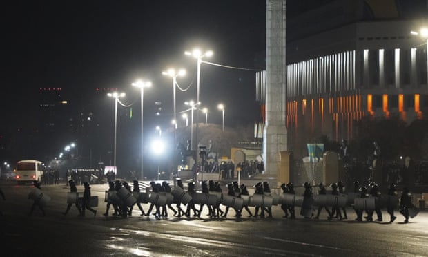 Riot police in central Almaty, where more than 5,000 people reportedly joined protests. Photograph: Vladimir Tretyakov/AP
