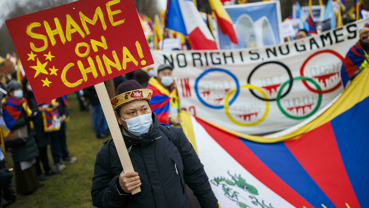 Tibetan protesters demonstrate against the 2022 Winter Olympics by marching from the International Olympic Committee (IOC) headquarters to the Olympic Museum in Lausanne, Switzerland on February 3, 2022. © Valentin Flauraud, AFP