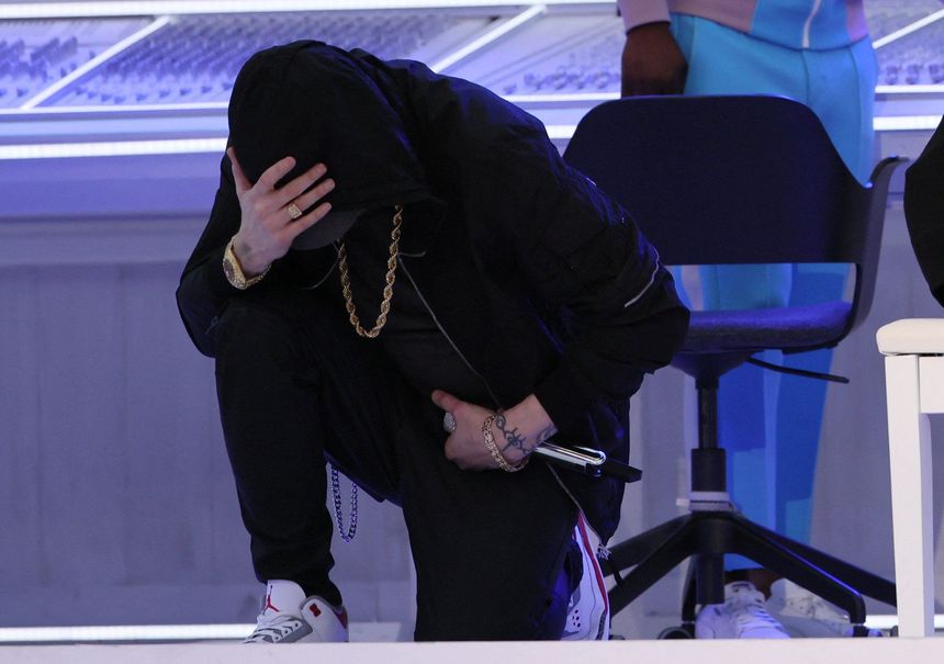 Eminem takes a knee during the halftime show. PHOTO: MIKE SEGAR/REUTERS