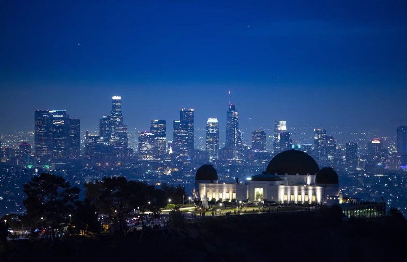 Dusk settles in over the city in a view above the Griffith Observatory toward downtown Los Angeles.(Brian van der Brug / Los Angeles Times)