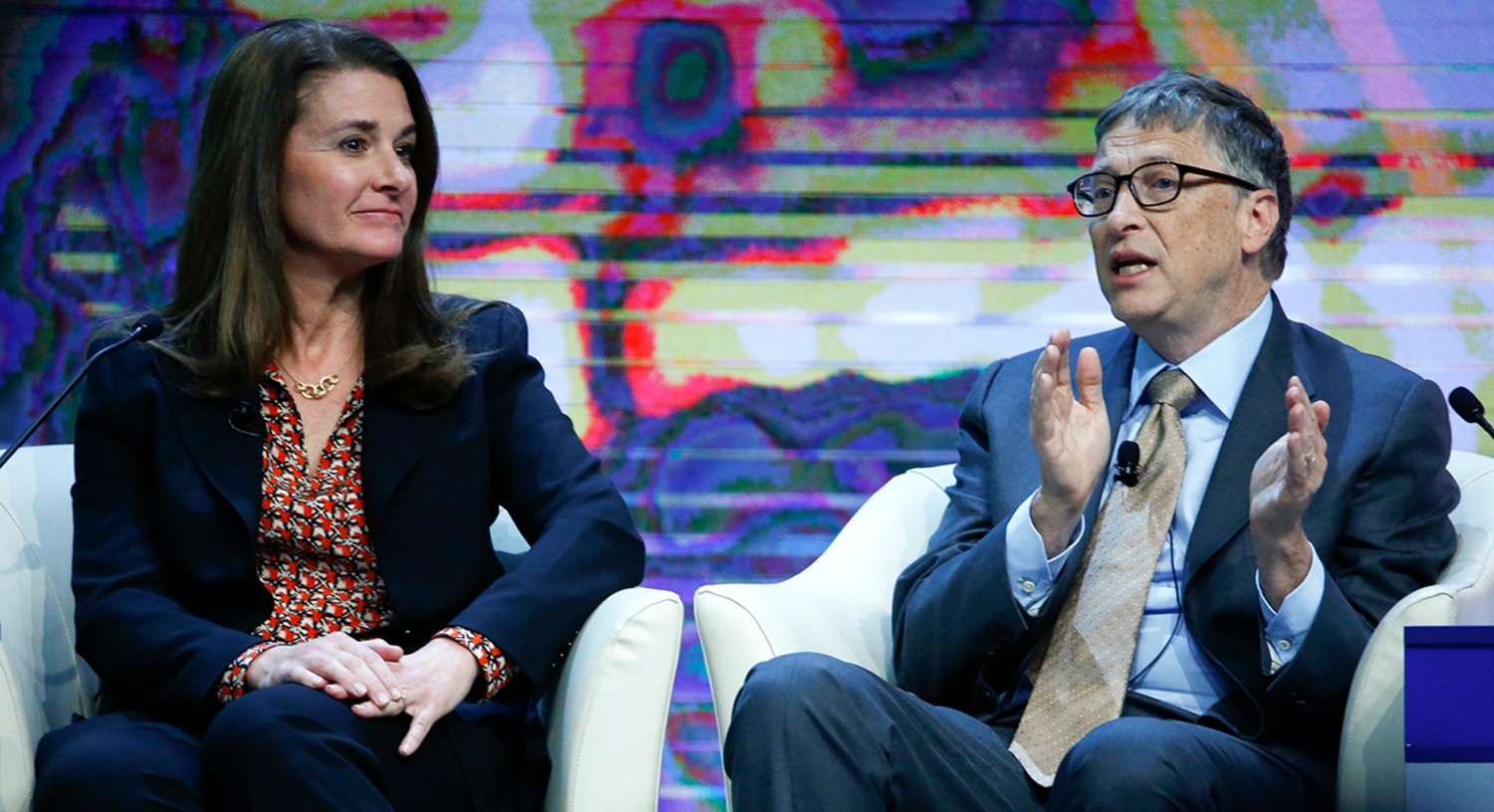 Bill Gates, co-chair of the Bill & Melinda Gates Foundation gestures next to his wife Melinda French Gates during the session "Sustainable Development: A Vision for the Future" in the Swiss mountain resort of Davos January 23, 2015.