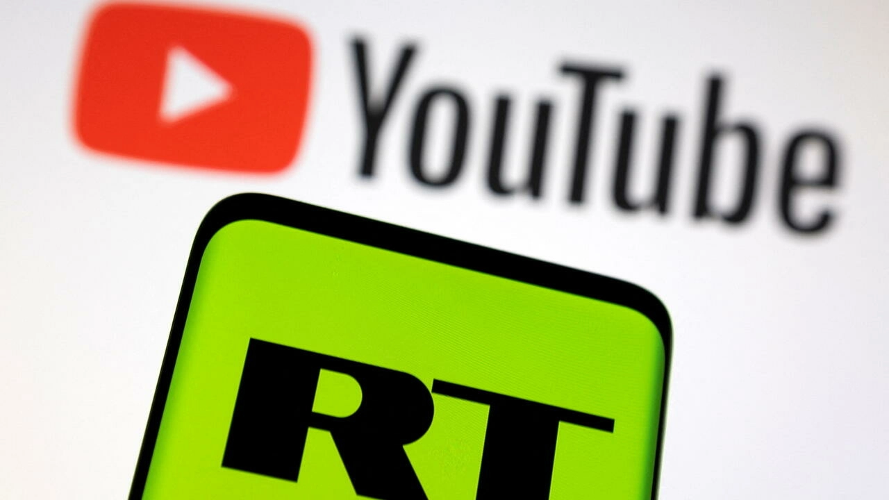 Russia Today (RT) logo is seen on a smartphone in front of displayed Youtube logo in this illustration picture taken February 26, 2022. © Dado Ruvic/Illustration, Reuters