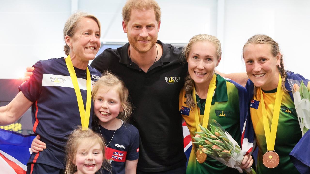 Harry poses with medallists at the swimming competition during day four of the Invictus Games. Picture: Chris Jackson/Getty Images for the Invictus Games Foundation