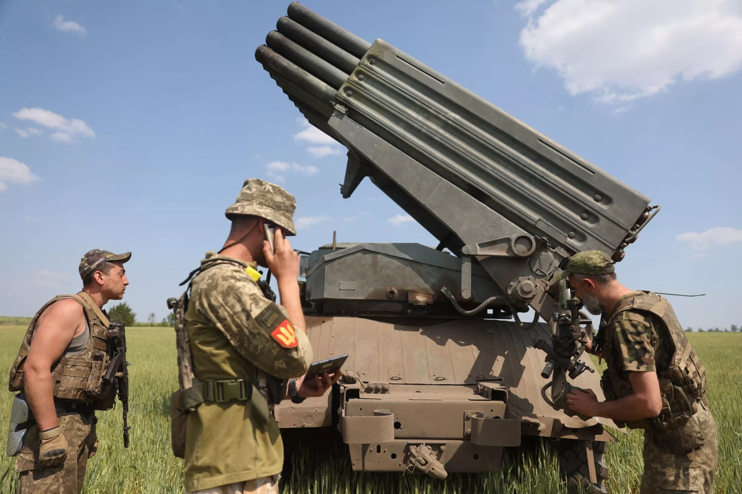 Ukrainian artillerymen prepare to fire a BM-21 Grad multiple rocket launcher near Izyum, south of Kharkiv, on June 11, 2022. Ukraine has called for an urgent delivery of western supplied arms. ANATOLII STEPANOV/GETTY IMAGES