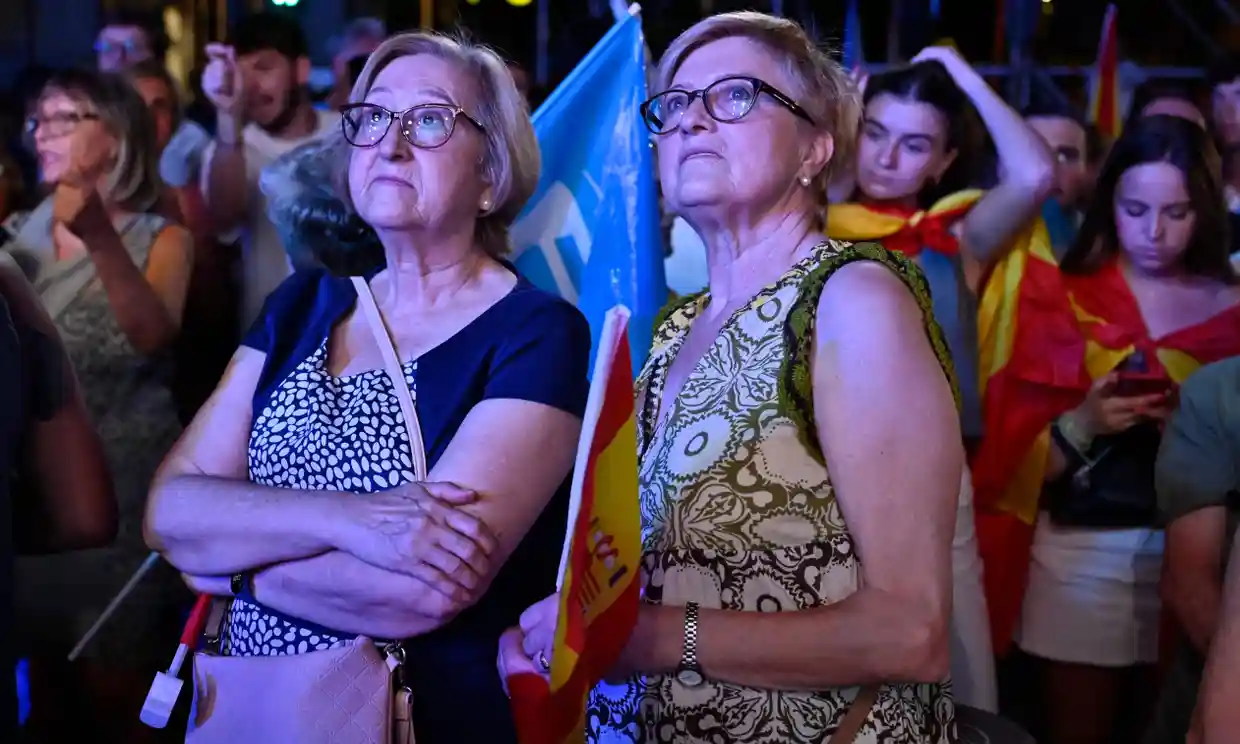 Supporters of the conservative People's party gather in Madrid. Spain has a hung parliament after neither major bloc secured an outright victory in elections. Photograph: Óscar del Pozo/AFP/Getty Images