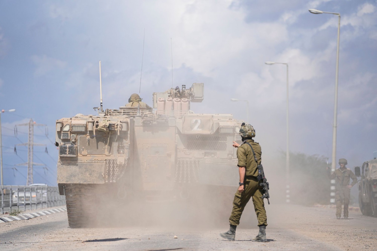 An Israeli armored personnel carrier heads toward the Gaza border. OHAD ZWIGENBERG/ASSOCIATED PRESS