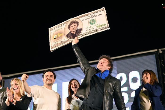 Javier Milei, who calls himself an anarcho-capitalist, raised a mock-up dollar bill with his depiction during a campaign event last week. PHOTO: ARIEL ALEJANDRO CARRERAS/SHUTTERSTOCK