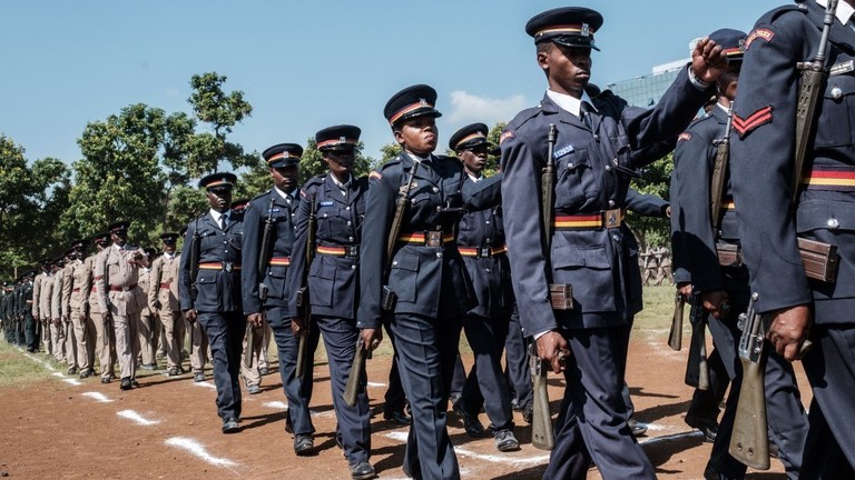 FILE PHOTO: Kenya police officers march in Kisumu, Kenya, on June 1, 2018. ©  Yasuyoshi CHIBA / AFP