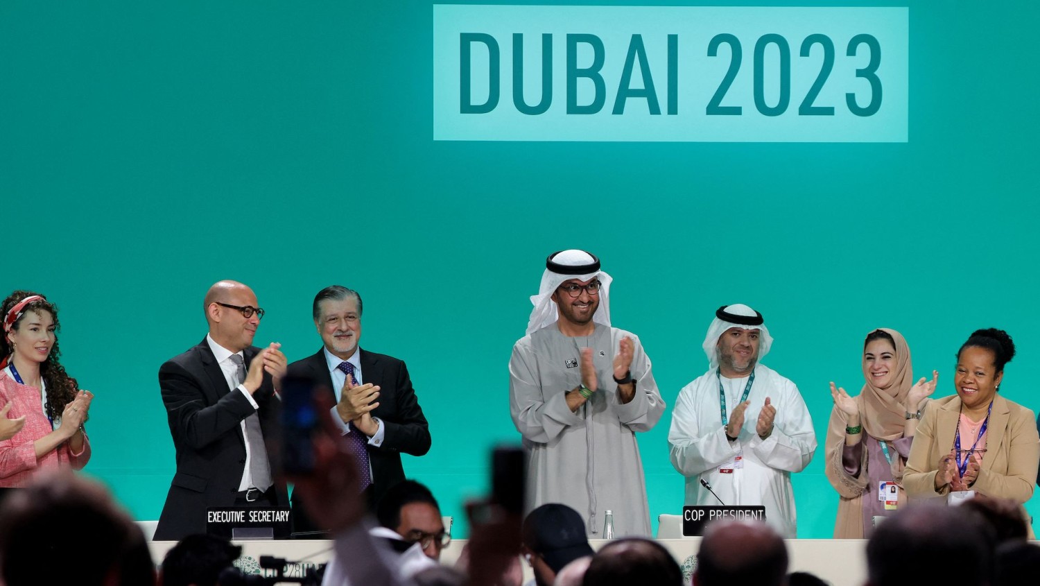 COP28 president Sultan Ahmed Al Jaber (center) applauds during a plenary sessions the United Nations climate summit in Dubai on December 13, 2023. Giuseppe Cacace/AFP/Getty Images