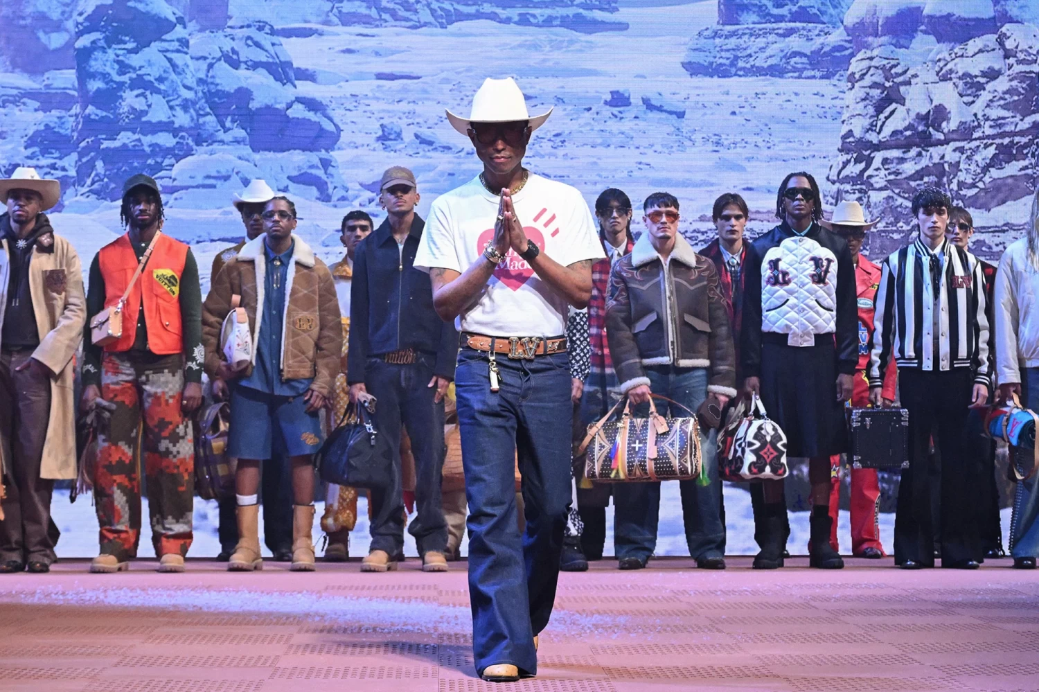 Creative director Pharrell Williams takes to the runway at the end of Louis Vuitton's Fall-Winter 2024-2025 show in Paris. Stephane Cardinale/Corbis/Getty Images