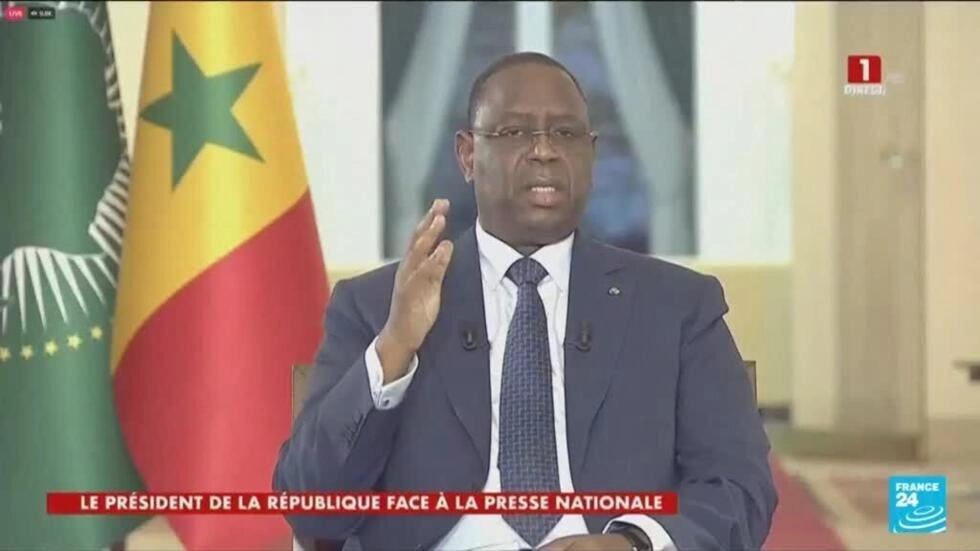 Senegal's president says he'll leave office in April, but gives no date for elections