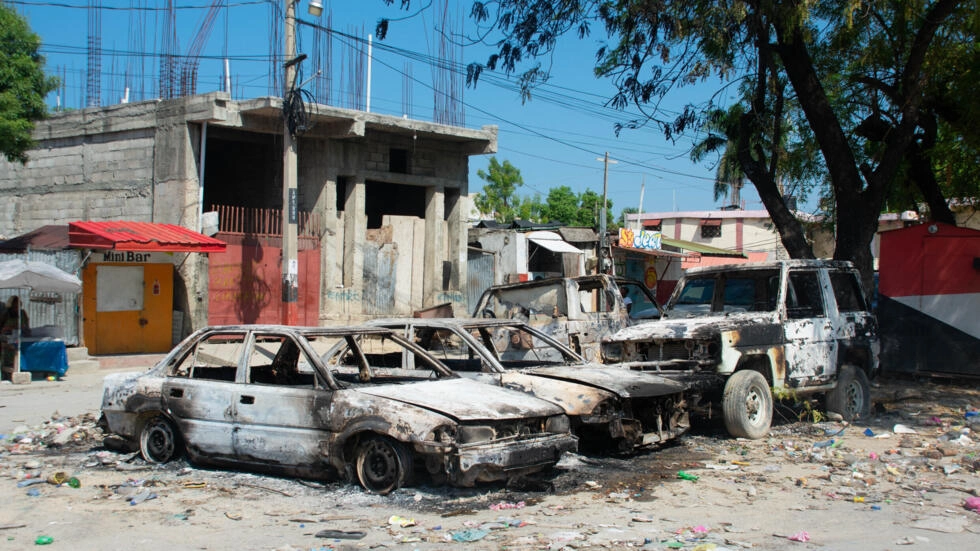 Charred vehicles are abandoned in an empty parking lot as gang violence escalates in Port-au-Prince, Haiti, March 9, 2024. © Clarens Siffroy, AFP