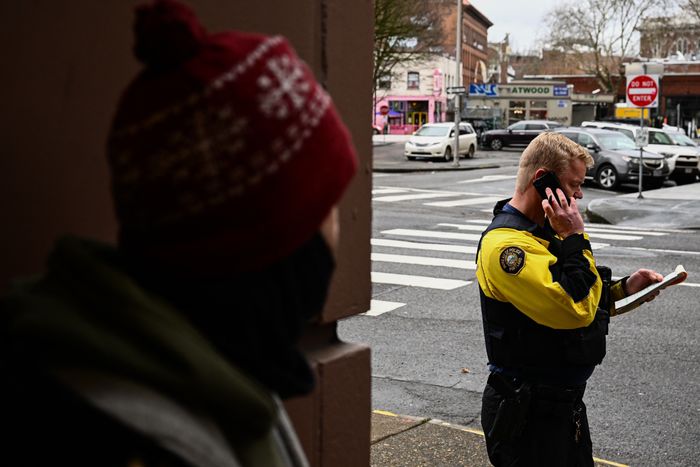 A Portland police officer writing someone a ticket for smoking drugs in public earlier this year. PHOTO: PATRICK T. FALLON/AGENCE FRANCE-PRESSE/GETTY IMAGES