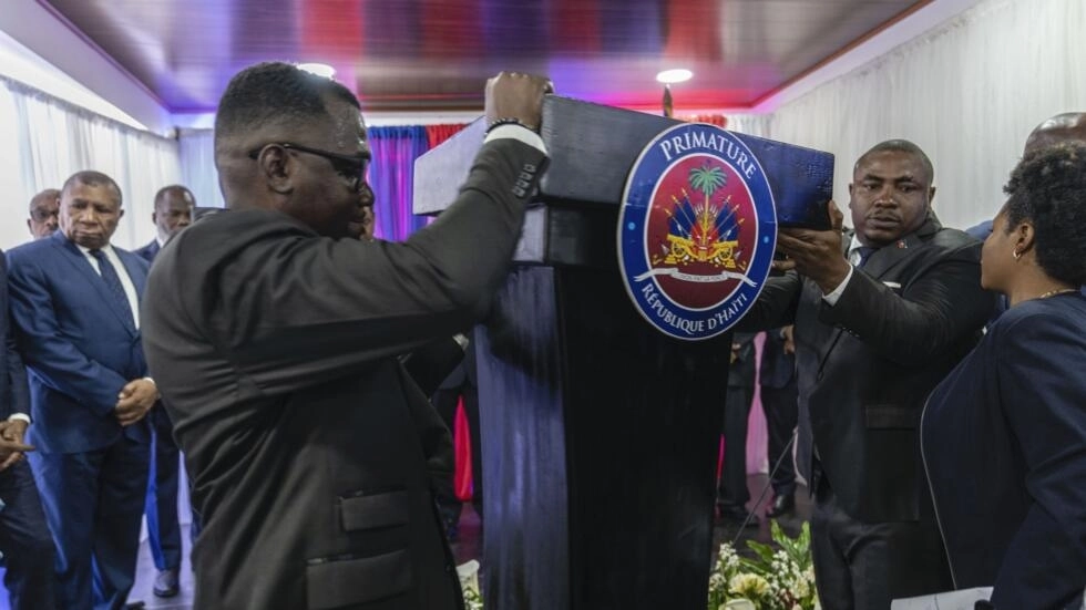 File photo of officials setting up the podium for a transitional council swearing-in ceremony in Port-au-Prince, Haiti, taken April 25, 2024. © Ramon Espinosa, AP