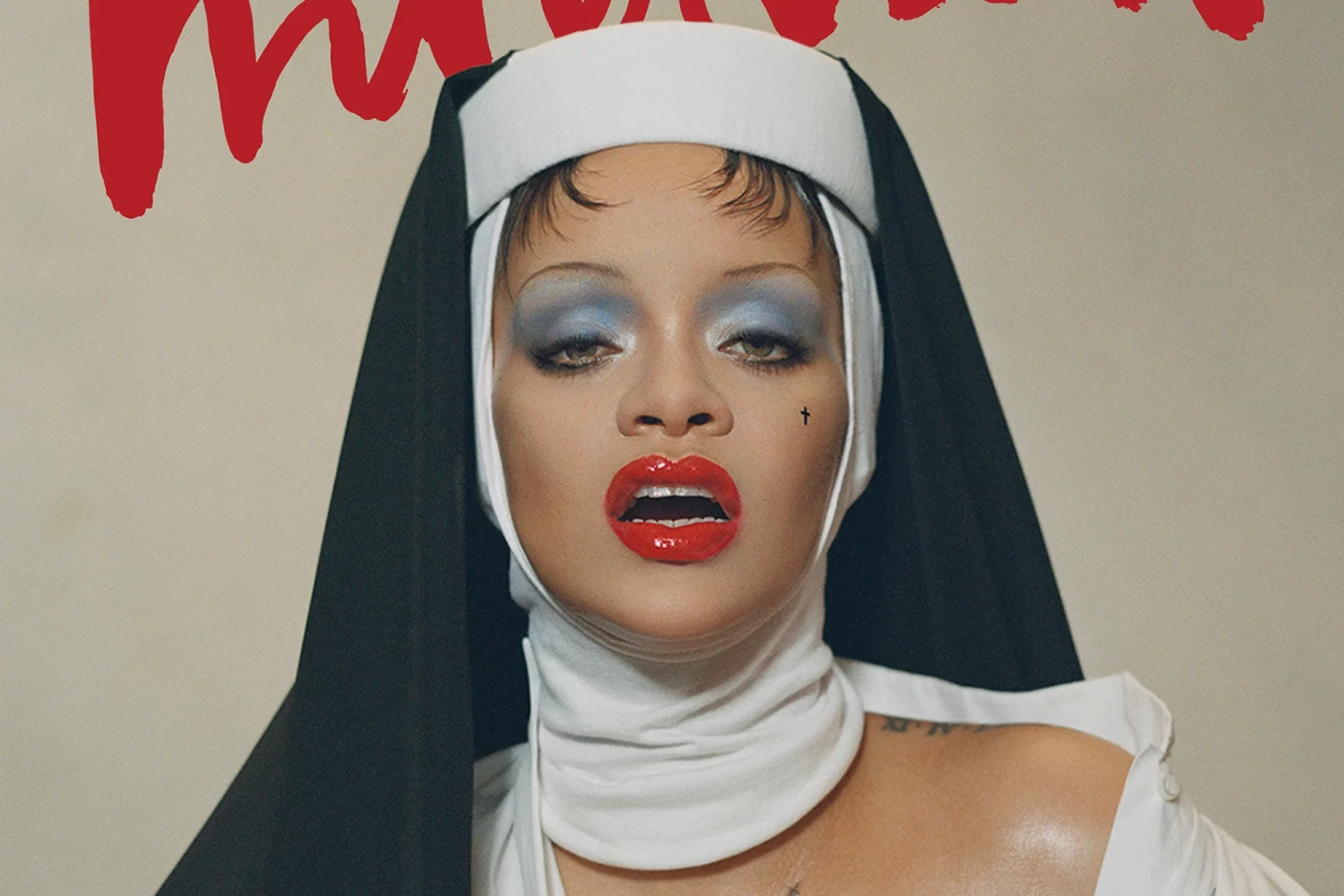 Rihanna is gracing the new cover of Interview magazine, dressed in a skin-baring Dior shirt and a custom wimple from milliner Sarah Sokol. Nadia Lee Cohen/Interview