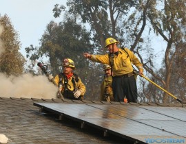 Firefighters work in the Bel Air Estates area of Los Angeles on Dec. 6, 2017.