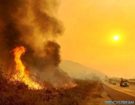 The Thomas Fire burns near Highway 101 in Ventura, Calif.