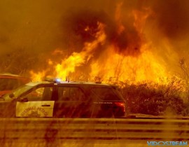 The Thomas Fire burns near Highway 101 in Ventura, Calif.